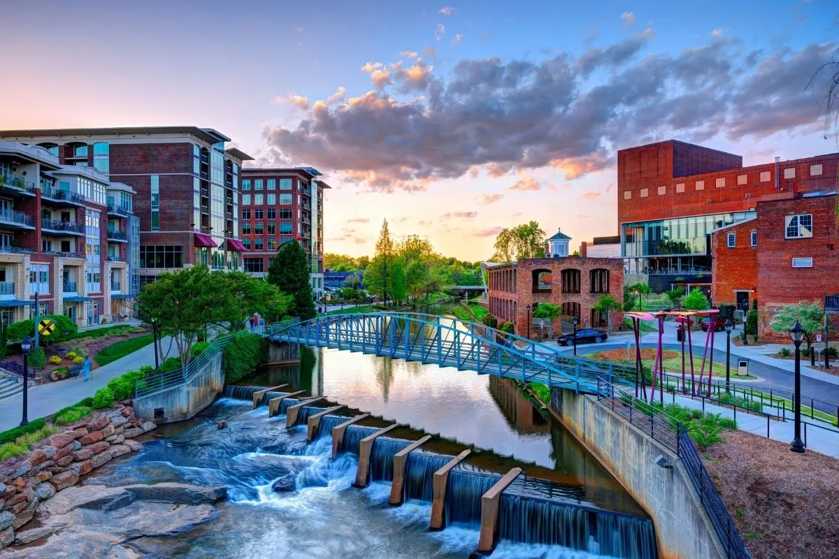Downtown Greenville SC at sunset with waterfall and bridge